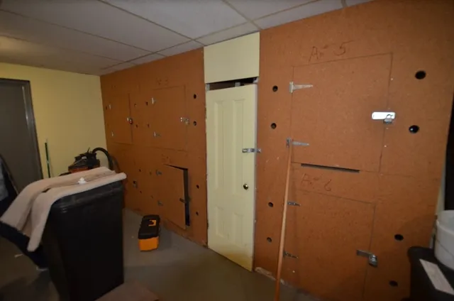 a view of storage and utility room with closet