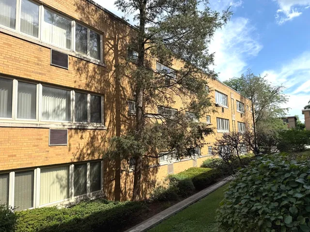 a view of a building with a yard