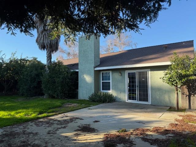 978 Doe Court Merced, CA 95340 - Photo 17 of 18 a front view of a house with garden