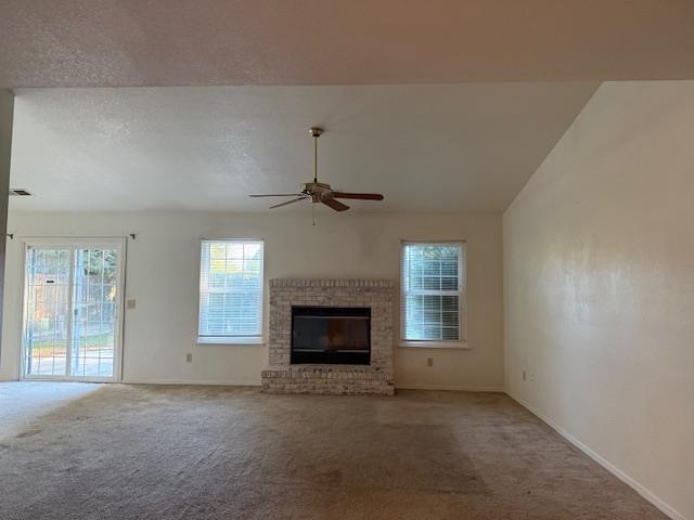 978 Doe Court Merced, CA 95340 - Photo 4 of 18 an empty room with windows and fireplace