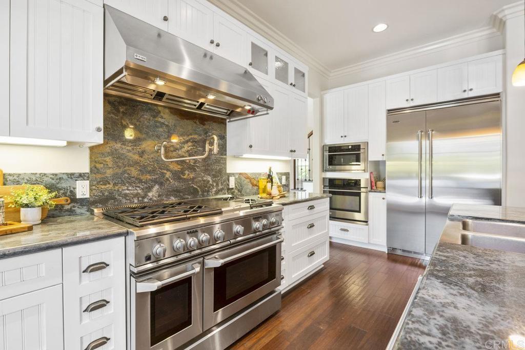 328 Cole Way Oceanside, CA 92054 - Photo 13 of 29 a kitchen with stainless steel appliances granite countertop a stove and a refrigerator