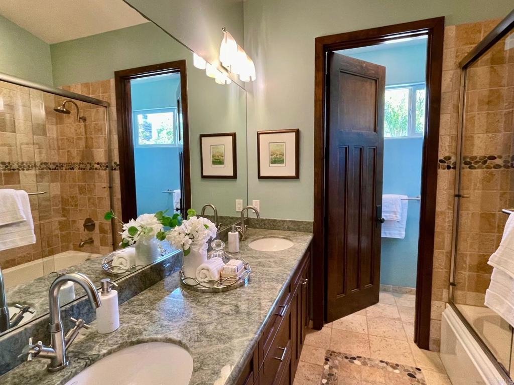 328 Cole Way Oceanside, CA 92054 - Photo 23 of 29 a bathroom with double vanity sinks a mirror and a shower