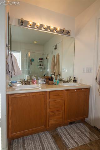 6789 Akron Road Colorado Springs, CO 80923 - Photo 17 of 28 5-piece master bathroom