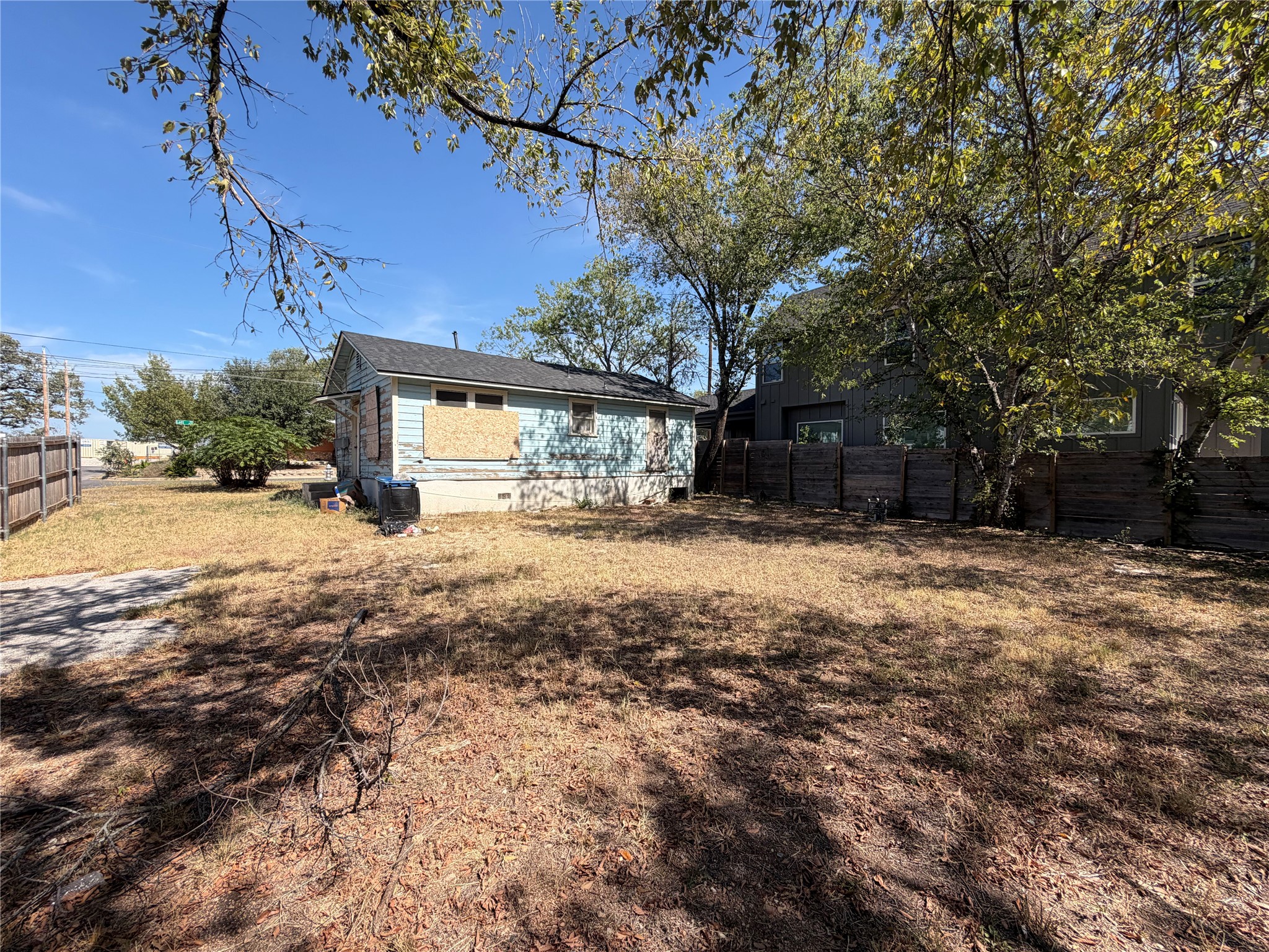 5001 Lott Avenue Austin, TX 78721 - Photo 7 of 9 a view of a yard covered in snow