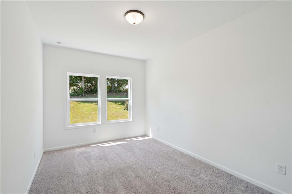 308 Silverleaf Trail Bethlehem, GA 30620 - Photo 13 of 36 an empty room with a window