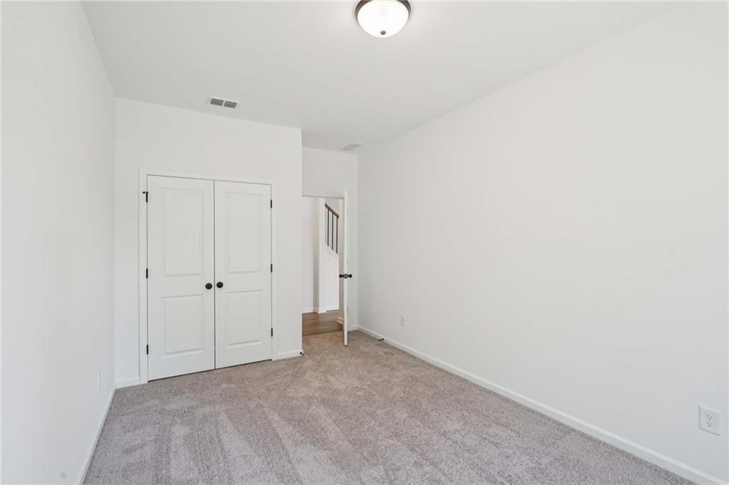 308 Silverleaf Trail Bethlehem, GA 30620 - Photo 14 of 36 a view of an empty room