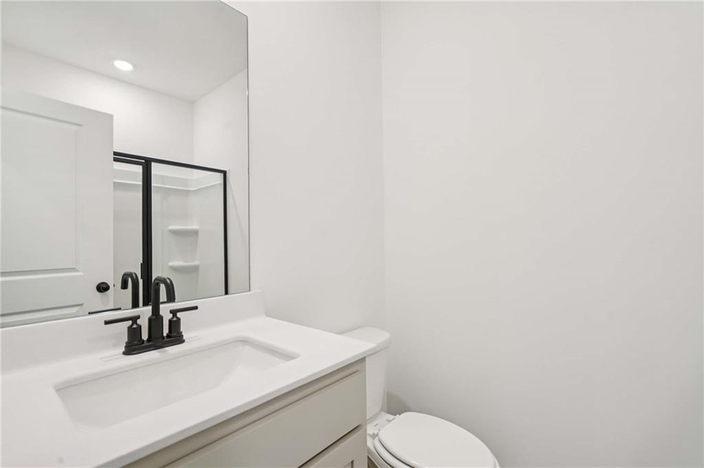 308 Silverleaf Trail Bethlehem, GA 30620 - Photo 15 of 36 a bathroom with a sink and a mirror