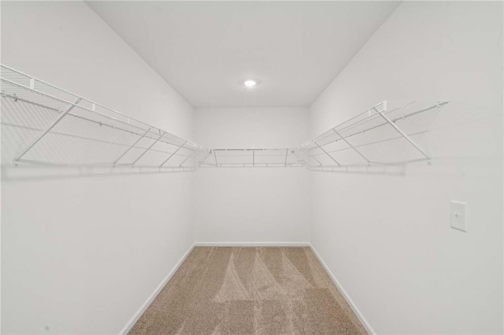 308 Silverleaf Trail Bethlehem, GA 30620 - Photo 19 of 36 a view of a room with racks on the wall