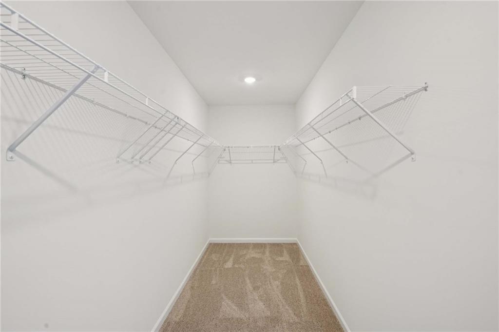 308 Silverleaf Trail Bethlehem, GA 30620 - Photo 22 of 36 a view of a room with racks on the wall