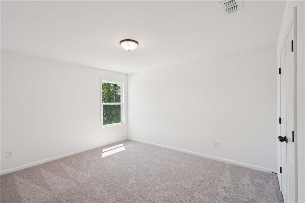 308 Silverleaf Trail Bethlehem, GA 30620 - Photo 23 of 36 an empty room with a window