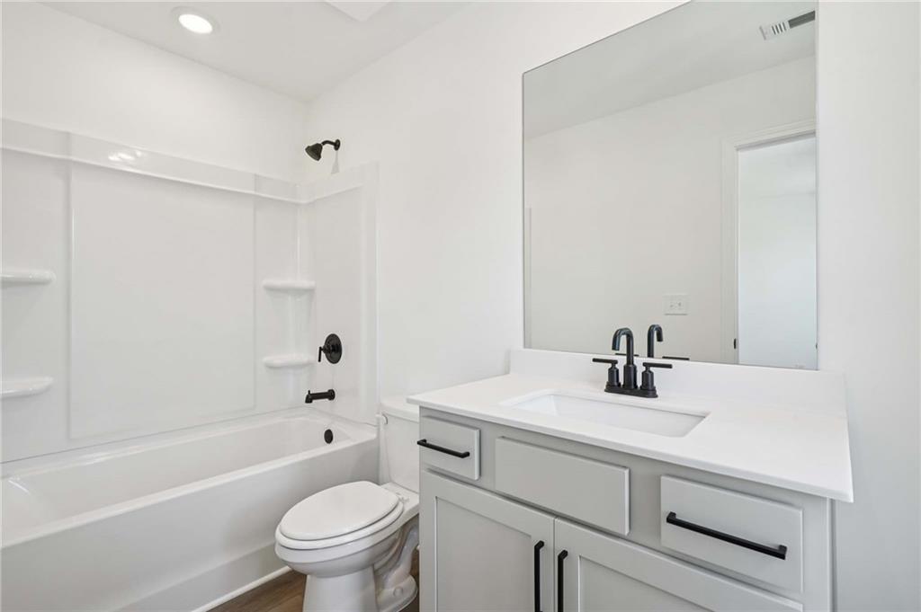 308 Silverleaf Trail Bethlehem, GA 30620 - Photo 26 of 36 a bathroom with a sink a toilet and a bathtub