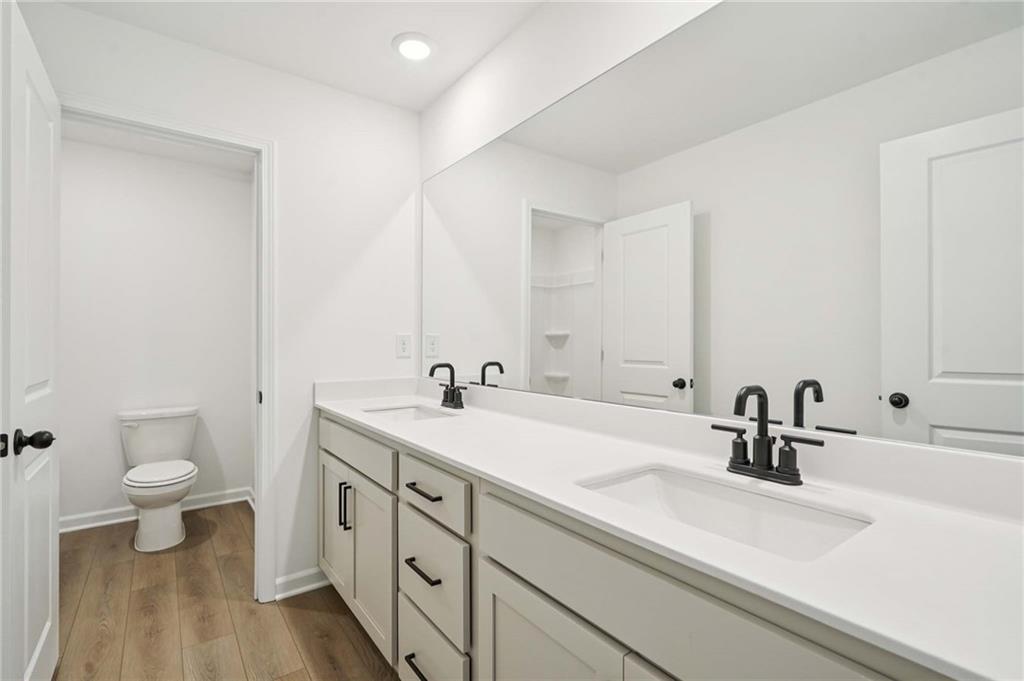 308 Silverleaf Trail Bethlehem, GA 30620 - Photo 27 of 36 a bathroom with a sink and a mirror