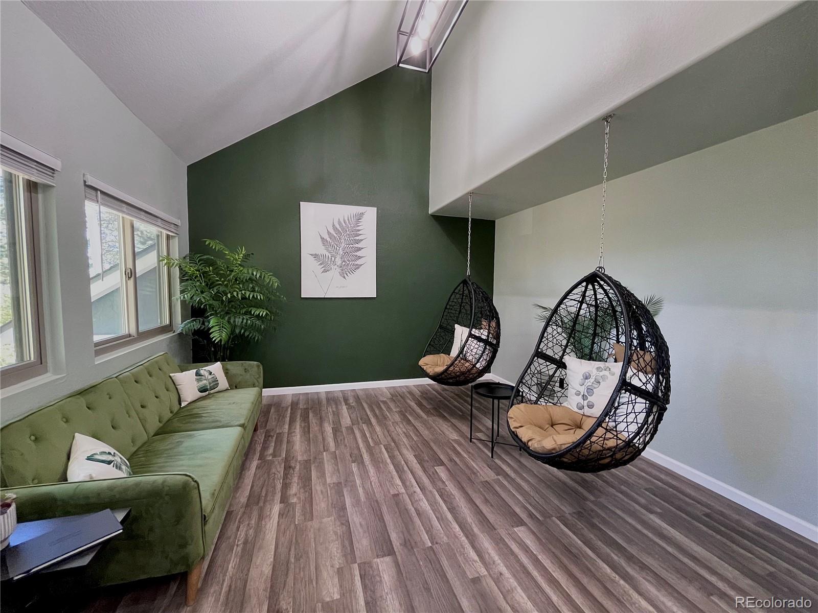 265 Caesar Road Black Hawk, CO 80422 - Photo 11 of 42 a living room with furniture and a wooden floor