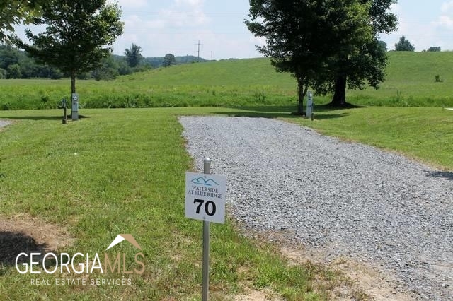 a view of a park with welcome board