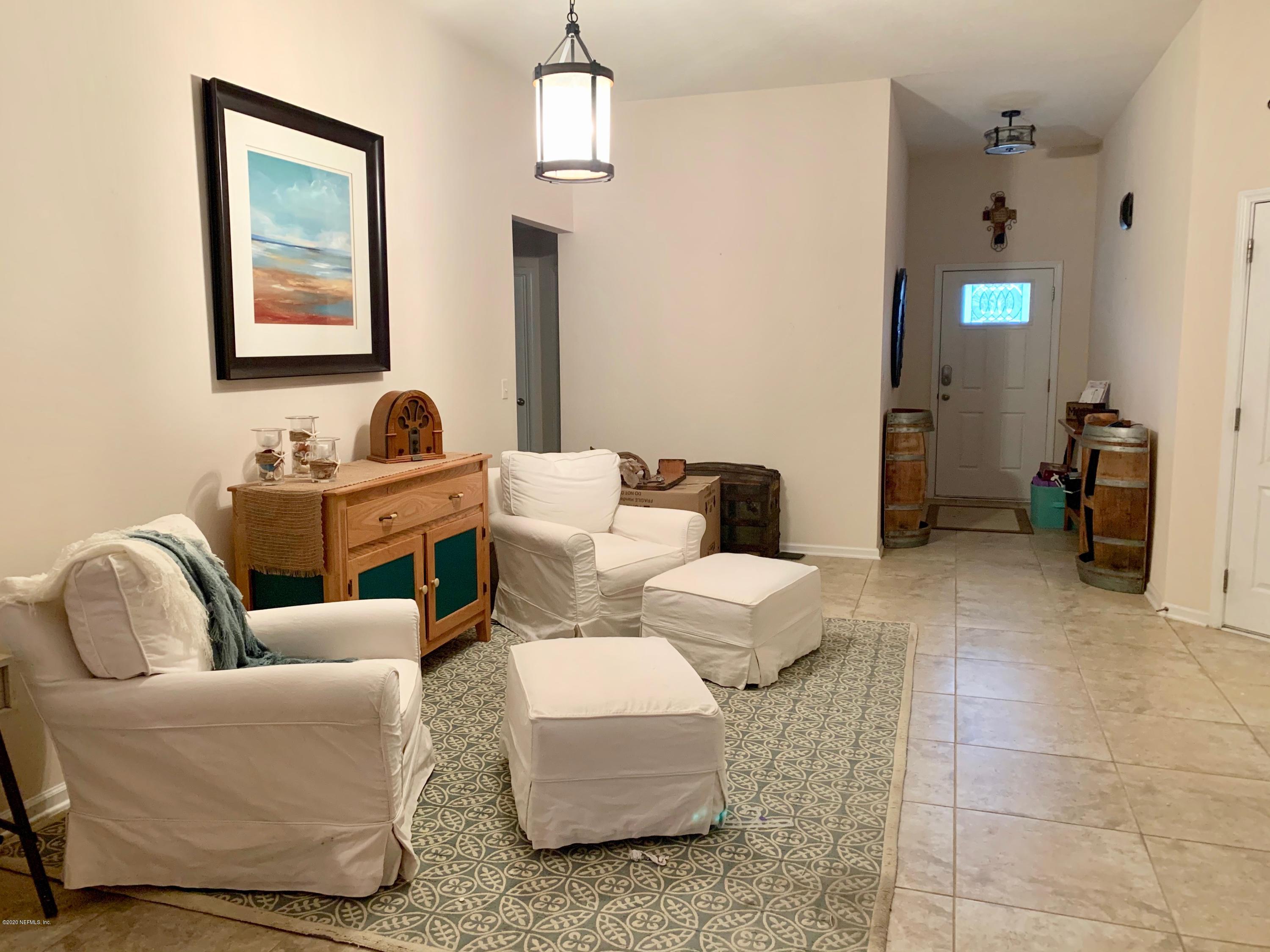 352 Irish Rose Road St. Augustine, FL 32092 - Photo 18 of 26 a living room with furniture and wooden floor