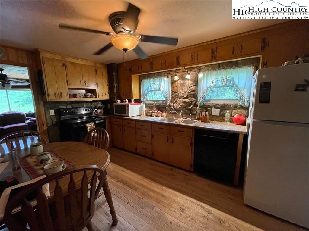 743 School House Road Whitetop, VA 24292 - Photo 4 of 30 a kitchen with a sink appliances and cabinets