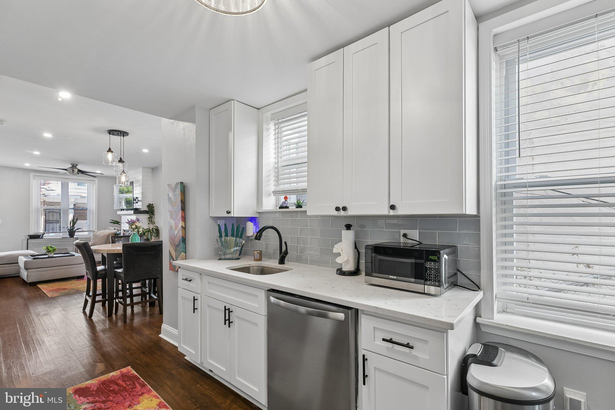 5365 Morris Street Philadelphia, PA 19144 - Photo 18 of 35 a kitchen with a white cabinets and chairs