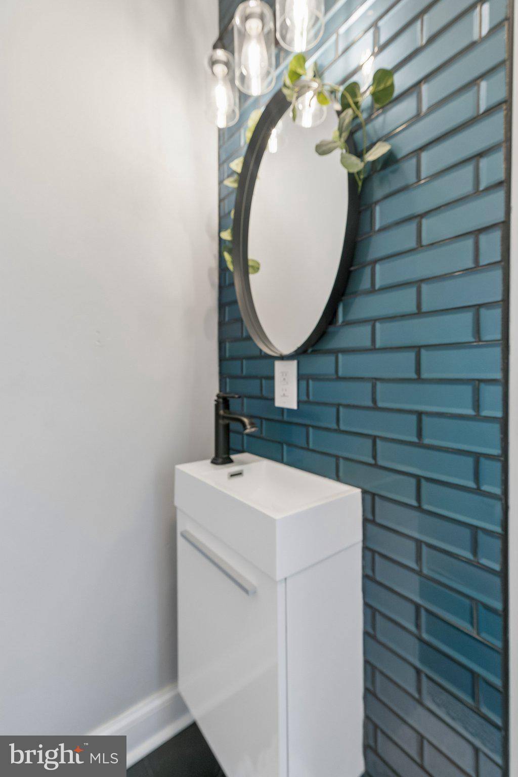 5365 Morris Street Philadelphia, PA 19144 - Photo 21 of 35 a bathroom with a sink and a mirror