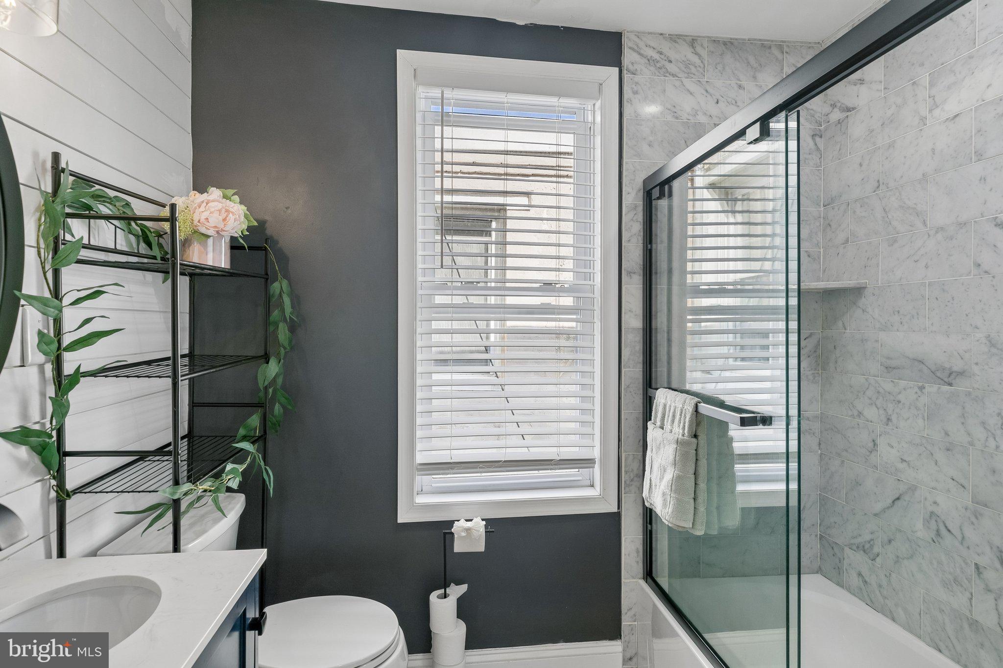 5365 Morris Street Philadelphia, PA 19144 - Photo 28 of 35 a bathroom with a toilet a sink and mirror