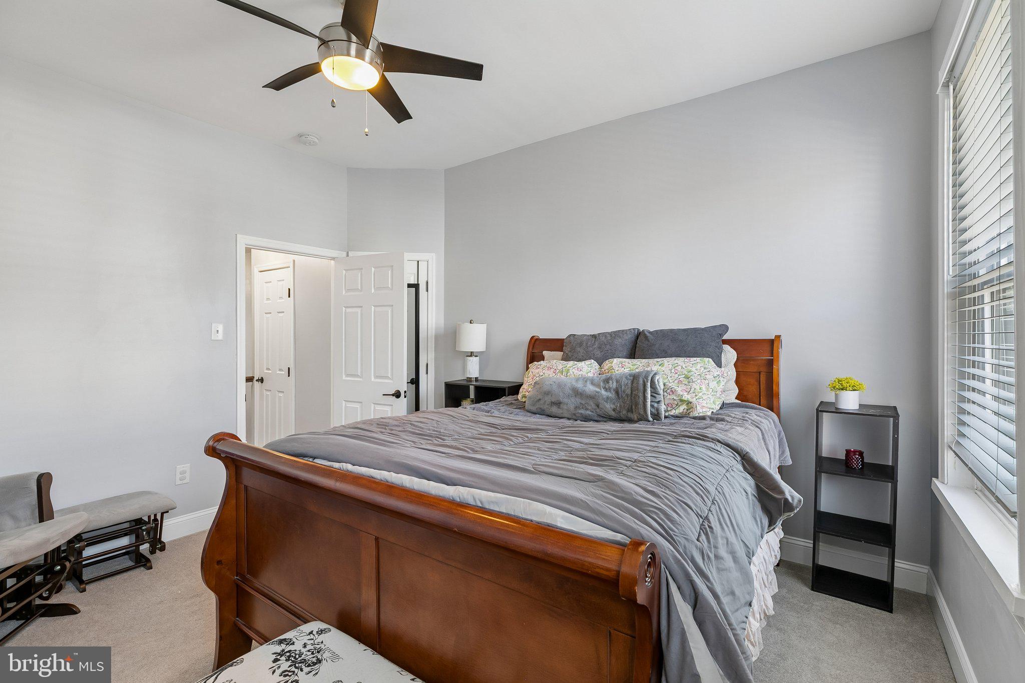 5365 Morris Street Philadelphia, PA 19144 - Photo 32 of 35 a bedroom with a bed and a chandelier