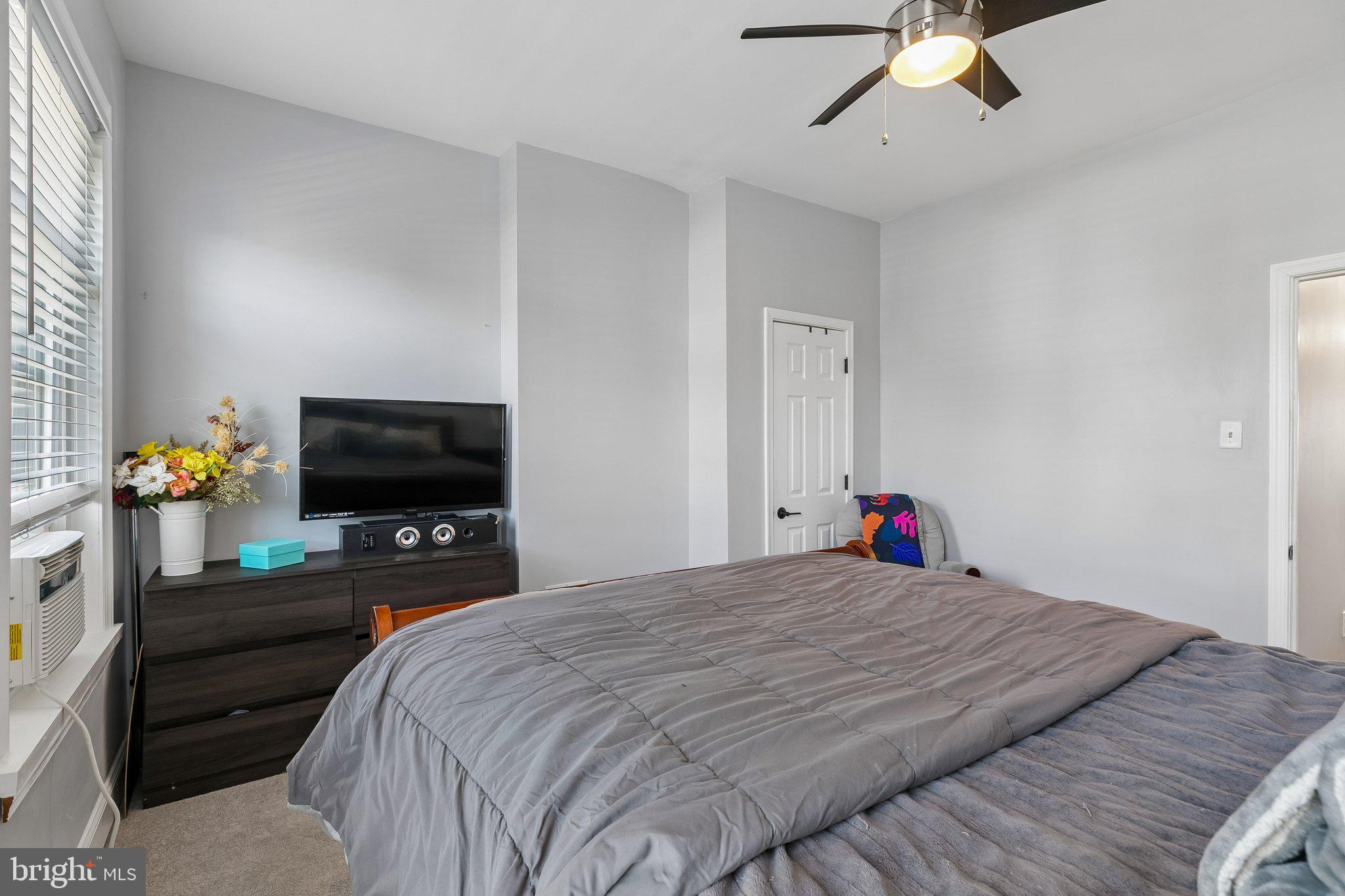 5365 Morris Street Philadelphia, PA 19144 - Photo 33 of 35 a bedroom with a bed and a flat screen tv