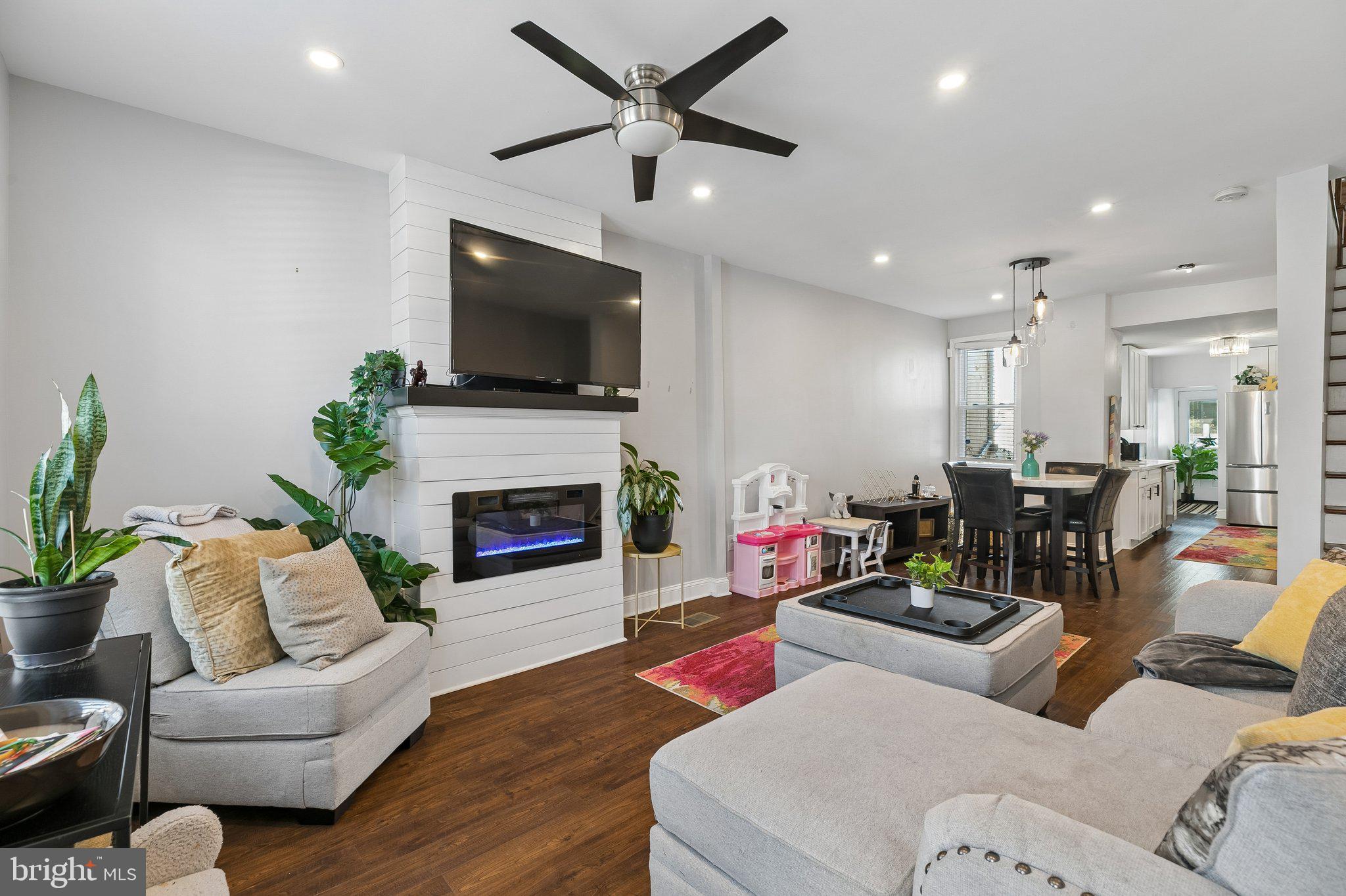 5365 Morris Street Philadelphia, PA 19144 - Photo 6 of 35 a living room with furniture fireplace and a flat screen tv