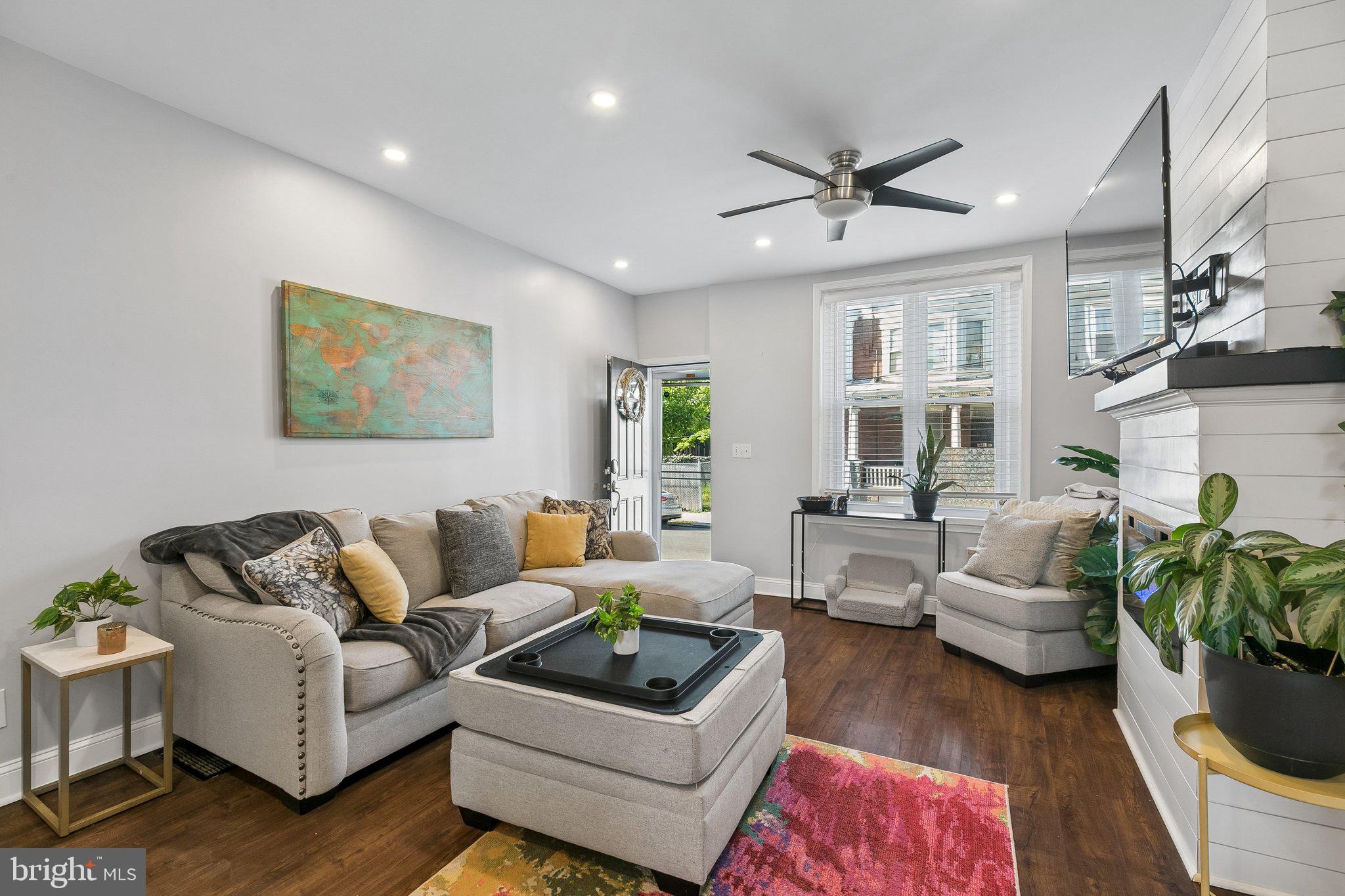 5365 Morris Street Philadelphia, PA 19144 - Photo 8 of 35 a living room with furniture a large window and a chandelier