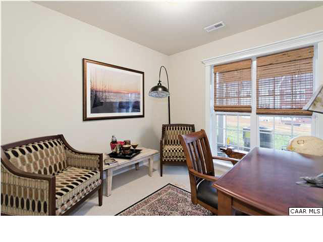 72 Avinity Loop Charlottesville, VA 22902 - Photo 4 of 19 a living room with furniture a rug and a large window