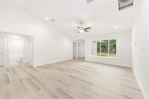 a view of an empty room with a window