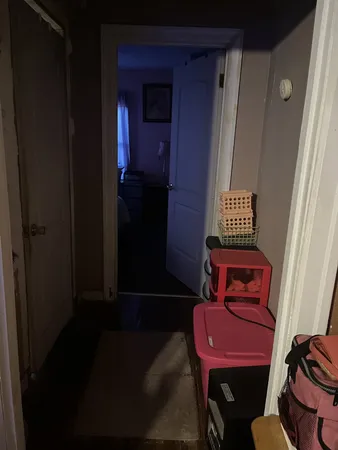 a view of a hallway with chairs