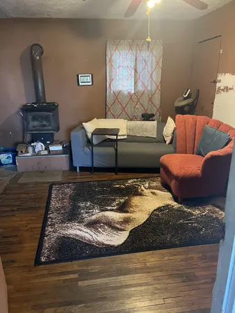 a living room with furniture and a rug