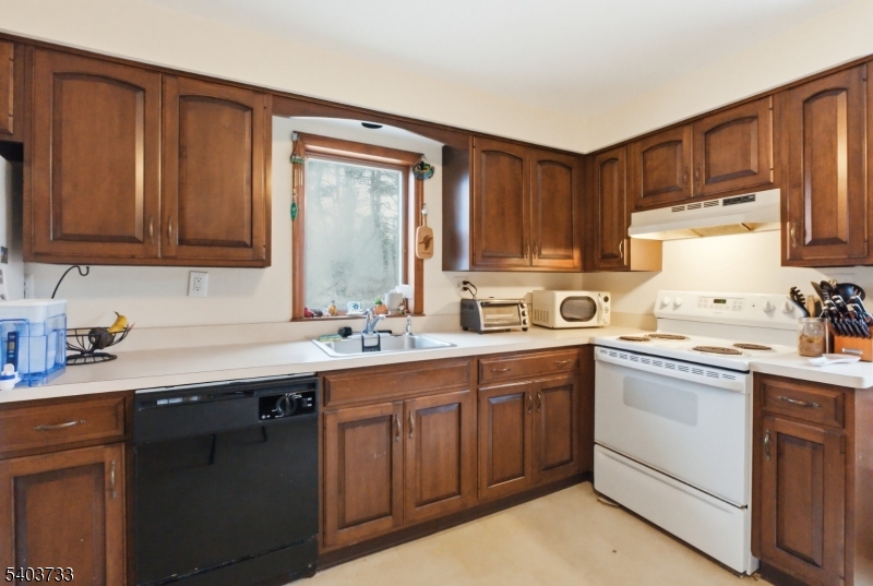 210 Highway 284 Wantage, NJ 07461 - Photo 11 of 28 a kitchen with a sink stove and cabinets