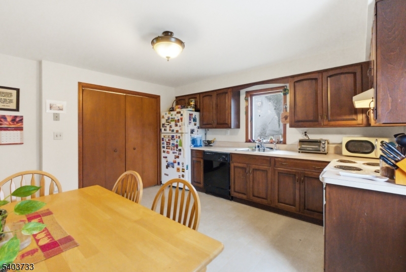 210 Highway 284 Wantage, NJ 07461 - Photo 12 of 28 a kitchen with stainless steel appliances granite countertop a stove top oven a sink dishwasher and cabinets
