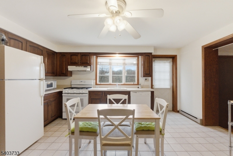 210 Highway 284 Wantage, NJ 07461 - Photo 13 of 28 a view of a dining room with furniture and a window