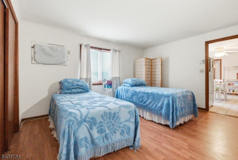 210 Highway 284 Wantage, NJ 07461 - Photo 17 of 28 a bedroom with two beds and painting on the wall