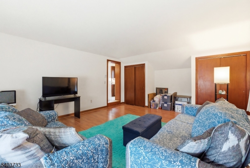 210 Highway 284 Wantage, NJ 07461 - Photo 20 of 28 a living room with furniture and a flat screen tv