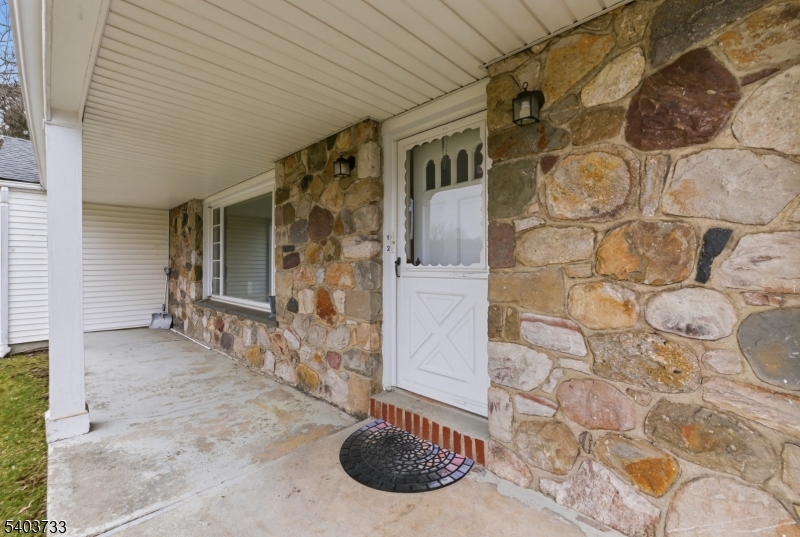 210 Highway 284 Wantage, NJ 07461 - Photo 4 of 28 a view of a door and chair in the patio