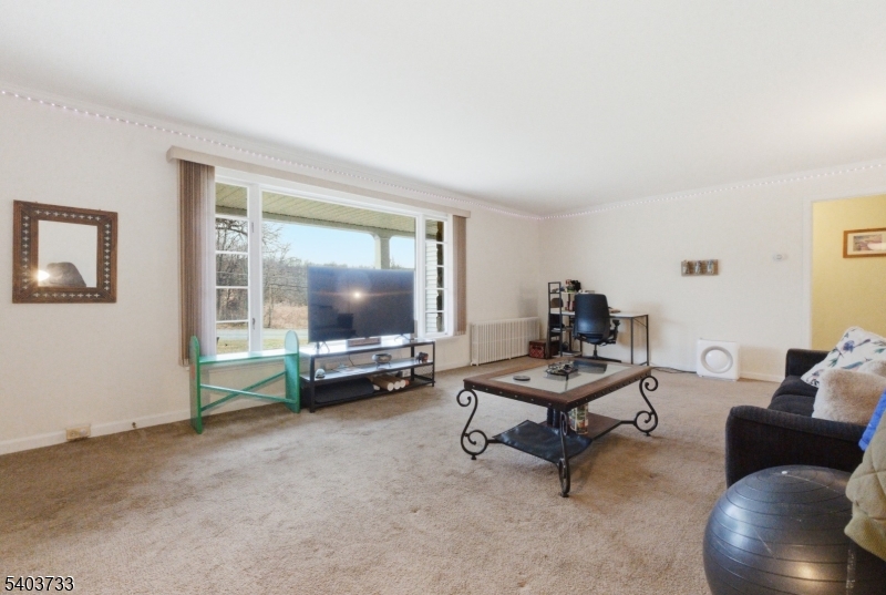210 Highway 284 Wantage, NJ 07461 - Photo 6 of 28 a living room with furniture and a flat screen tv