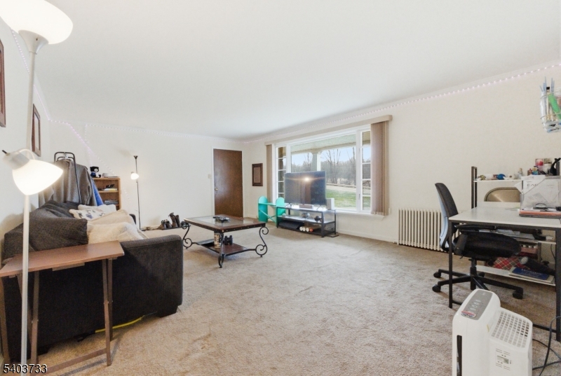 210 Highway 284 Wantage, NJ 07461 - Photo 7 of 28 a living room with furniture and a large window