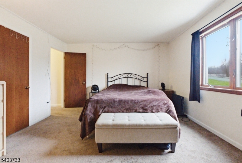 210 Highway 284 Wantage, NJ 07461 - Photo 8 of 28 a bedroom with a bed and window