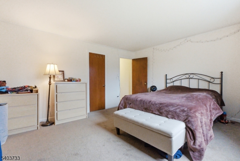 210 Highway 284 Wantage, NJ 07461 - Photo 9 of 28 a bedroom with a bed and dresser