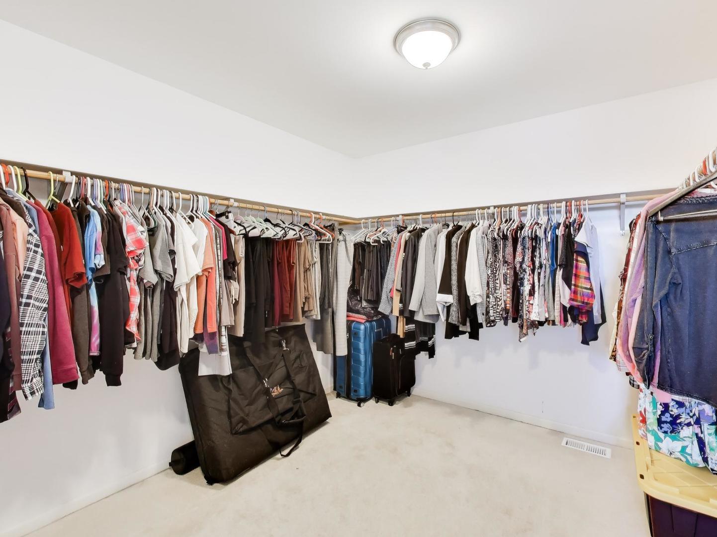 660 Robin Ridge Elgin, IL 60123 - Photo 15 of 29 a view of walk in closet with clothes