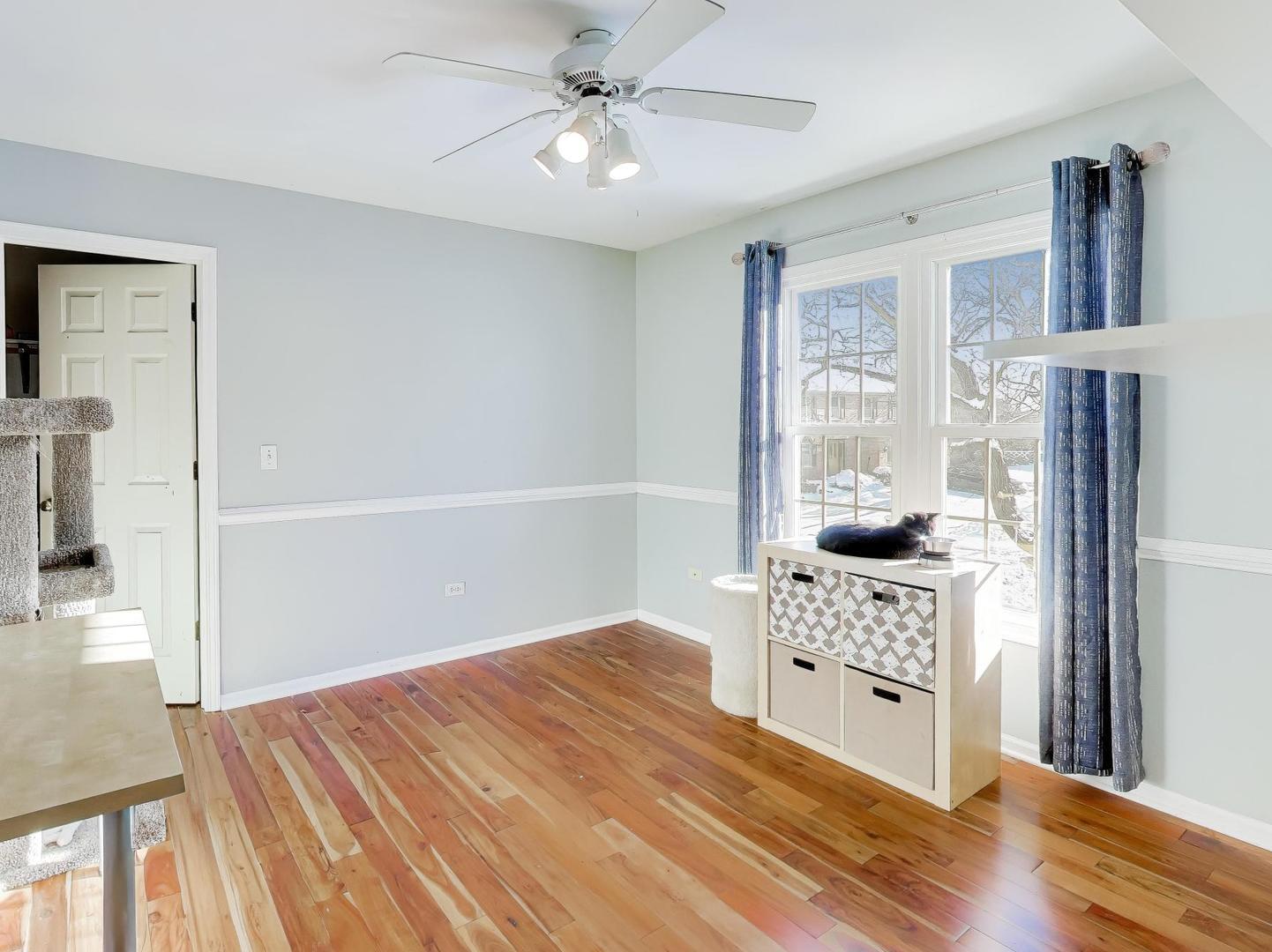 660 Robin Ridge Elgin, IL 60123 - Photo 19 of 29 a bedroom with a bed dresser and a window