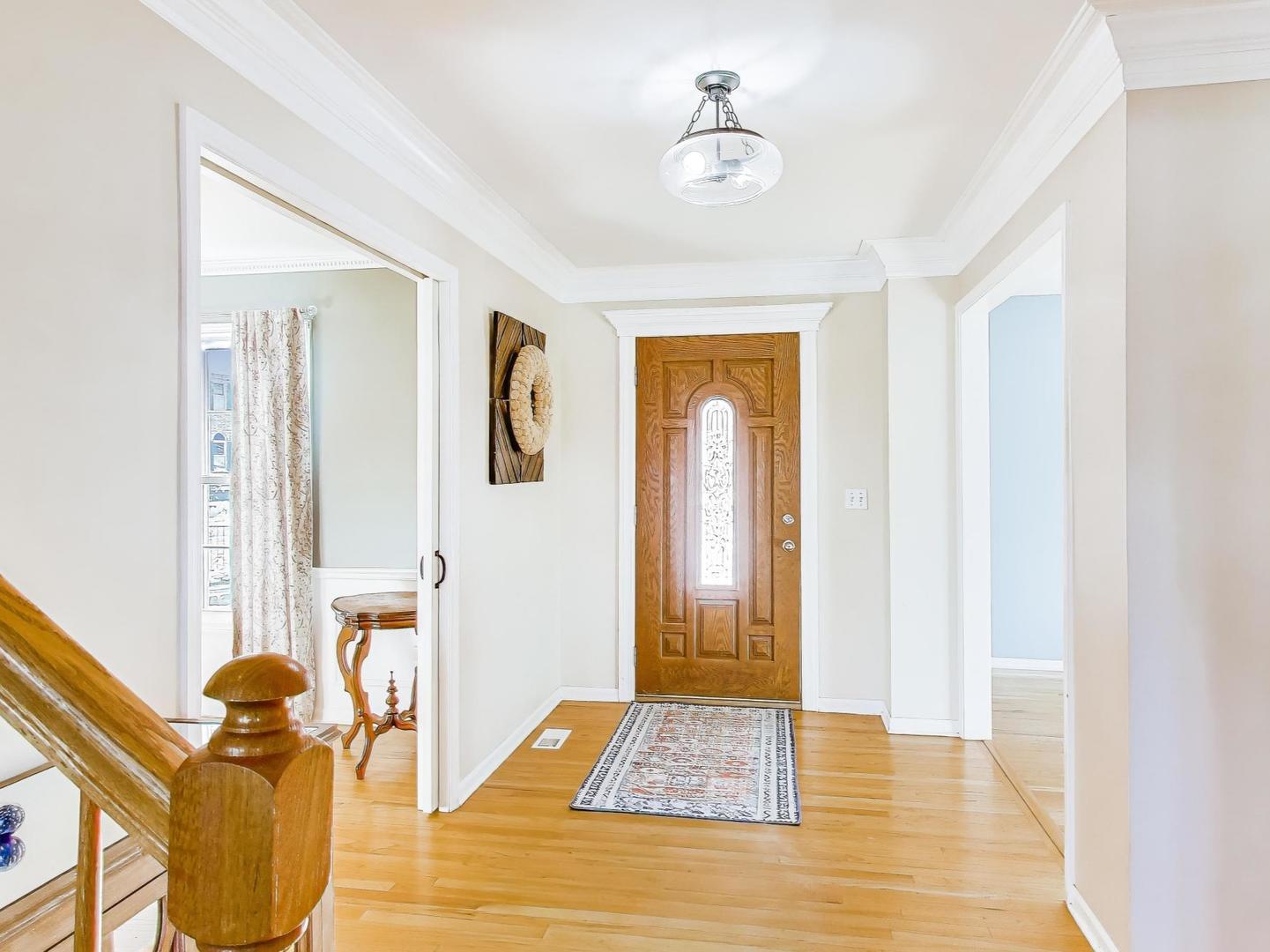 660 Robin Ridge Elgin, IL 60123 - Photo 2 of 29 a view of an entryway with wooden floor