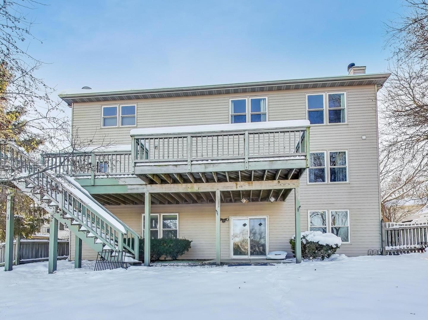 660 Robin Ridge Elgin, IL 60123 - Photo 28 of 29 a view of a house with a patio and a yard