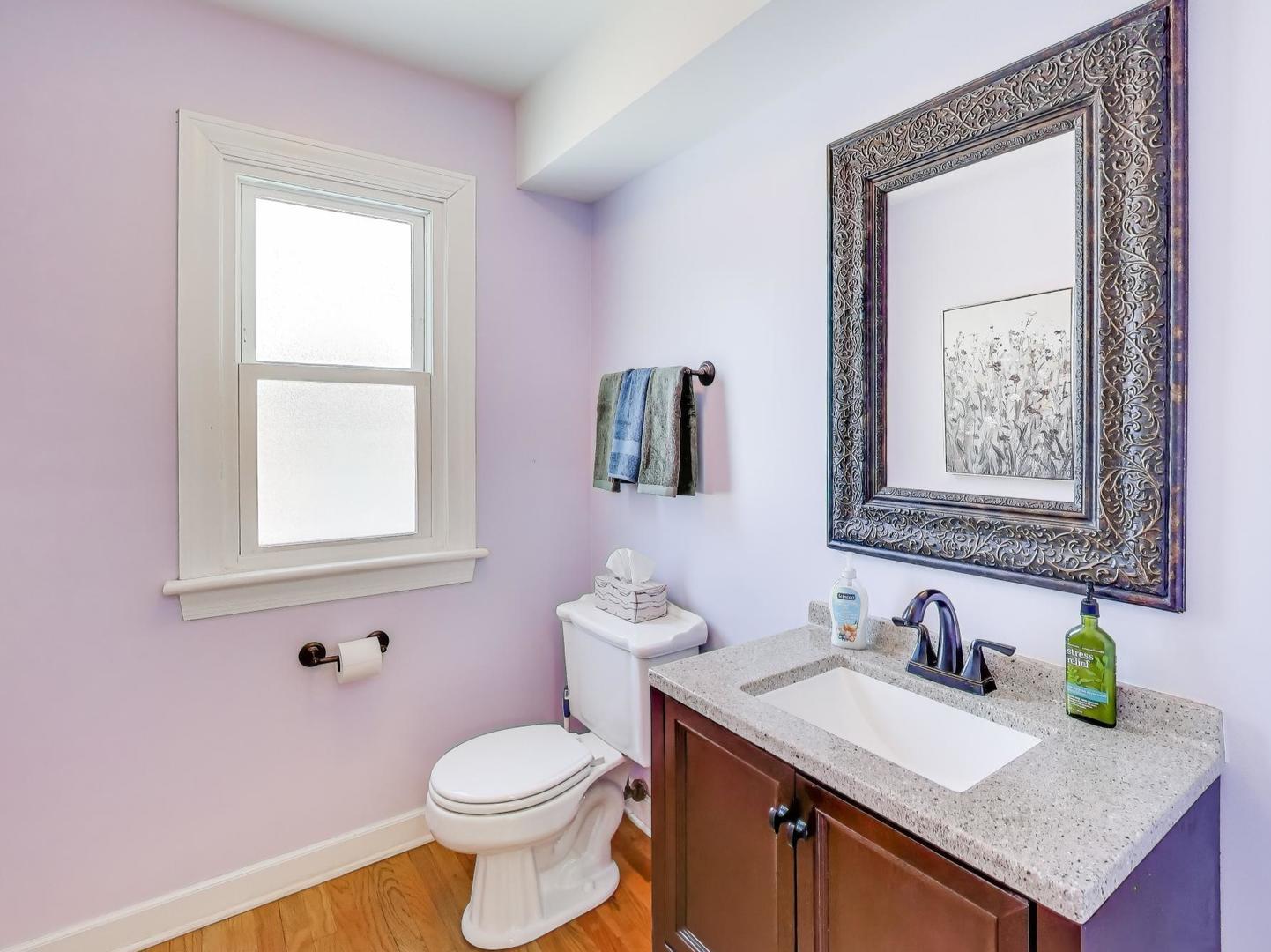 660 Robin Ridge Elgin, IL 60123 - Photo 4 of 29 a bathroom with a granite countertop toilet sink and mirror