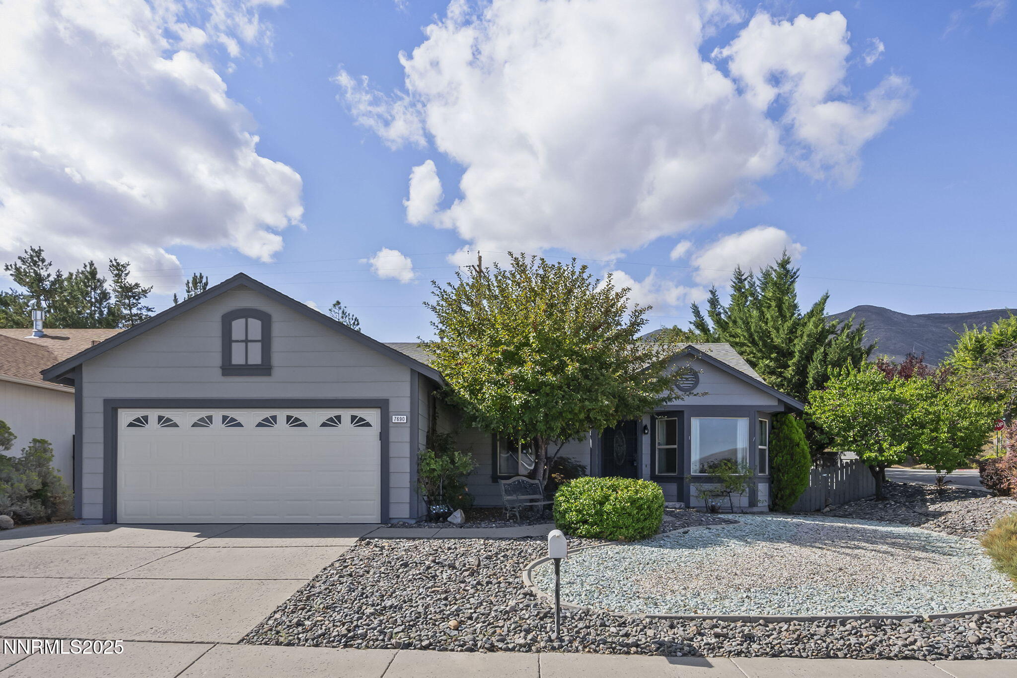 7690 Deep Bay Drive Reno, NV 89506 - Photo 1 of 26 a front view of a house with garden