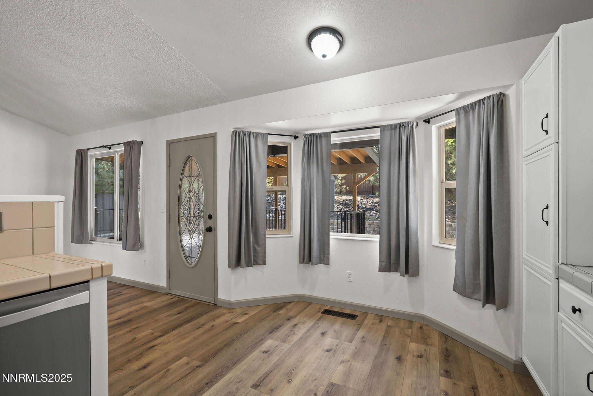 7690 Deep Bay Drive Reno, NV 89506 - Photo 11 of 26 wooden floor in an empty room with a window