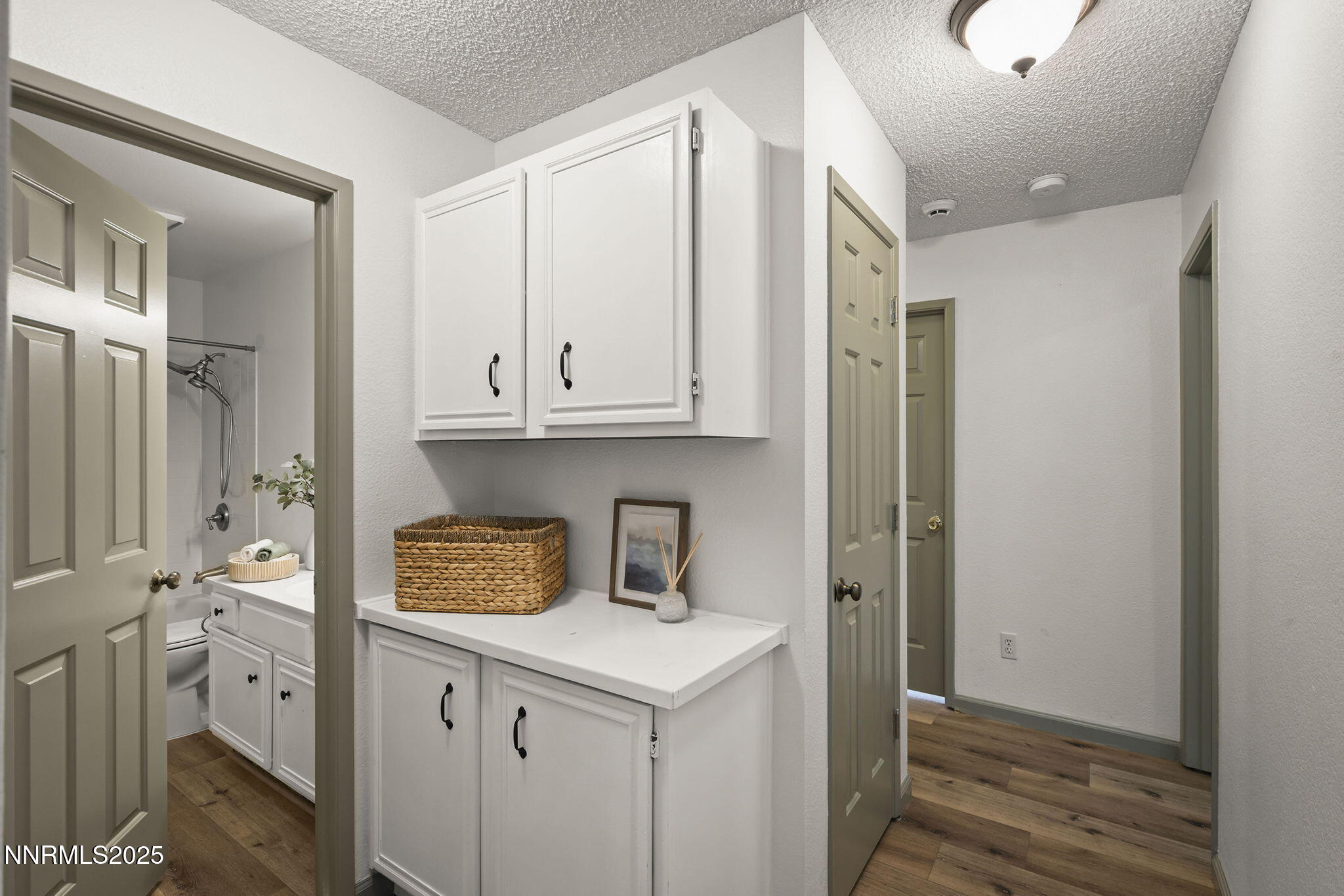 7690 Deep Bay Drive Reno, NV 89506 - Photo 12 of 26 a kitchen with cabinets and a refrigerator
