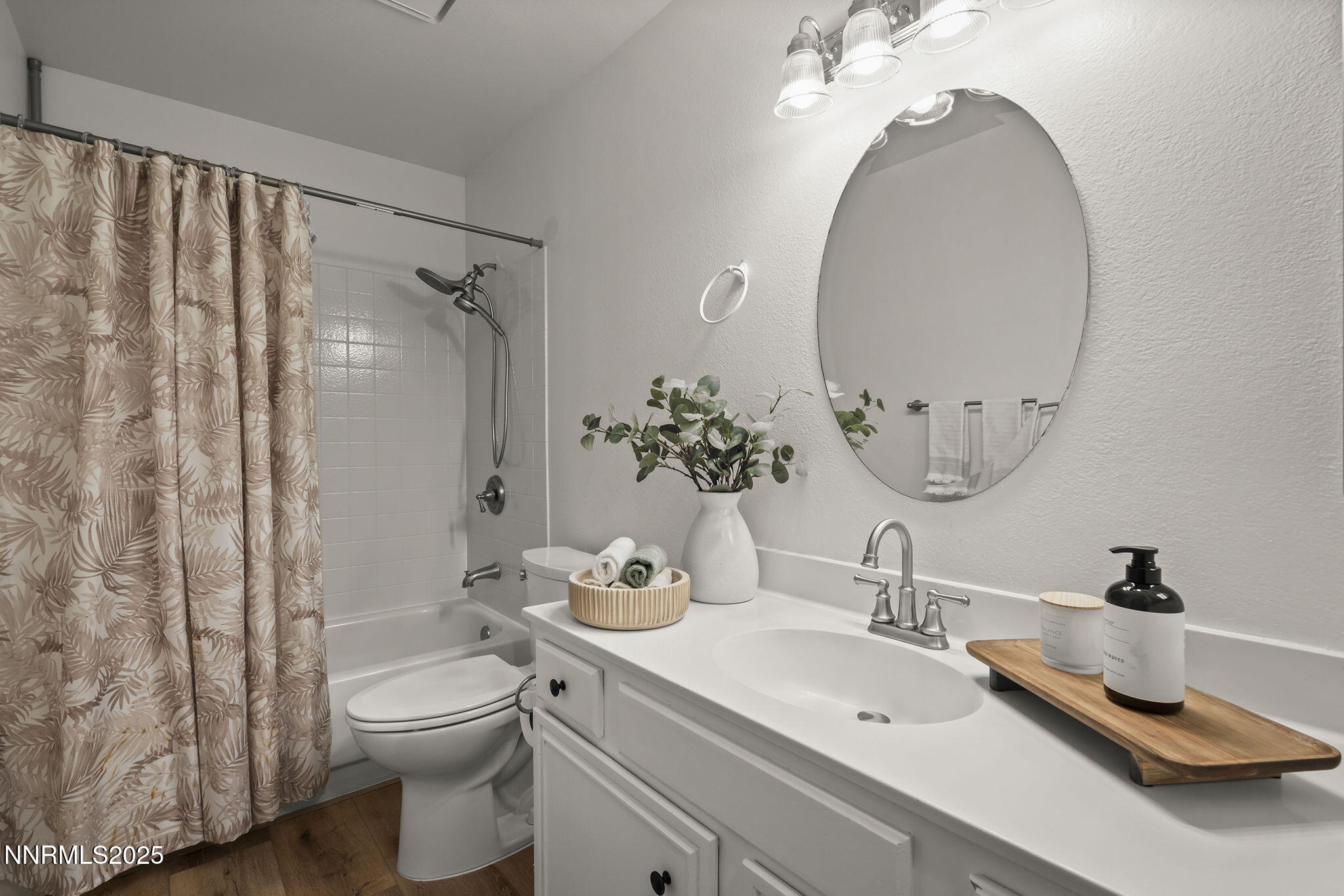 7690 Deep Bay Drive Reno, NV 89506 - Photo 13 of 26 a bathroom with a toilet a sink and mirror